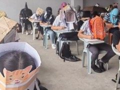 菲律宾大学生自制“防作弊帽”走红Philippines: Student 'anti-cheating' exam hats go viral